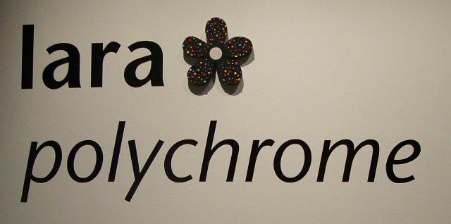 polychrome opening night (3).JPG - the maquette worked well and we decided to use it in the gallery name/title wall  - lara signs all here artwork just as "lara" and a small 5-petaled flower outline